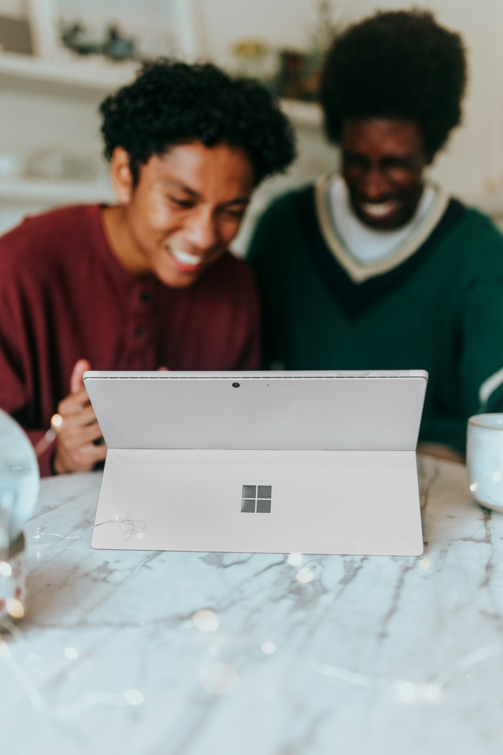People collaborating at a laptop